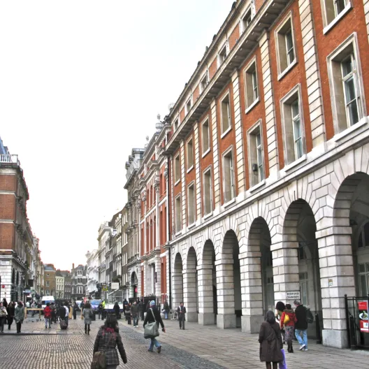 Bon Scott eating a banana in this spot in Covent Garden — London, England